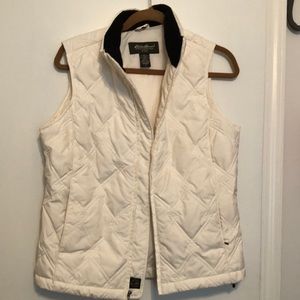 Goose down vest.  Quilted, off white with zip and black velvet collar.